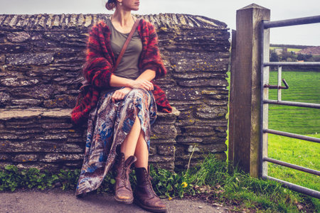 Young woman relaxing in countrysideの写真素材