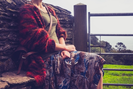 Young woman relaxing in countrysideの写真素材