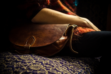Young woman with a leather handbagの写真素材