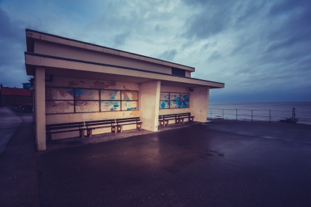 Old building by the sea on a gloomy dayの写真素材