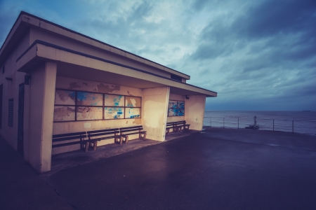 Old building by the sea on a gloomy dayの写真素材