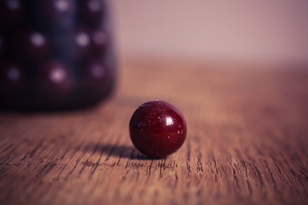 Sugar coated balls on a wooden tableの写真素材