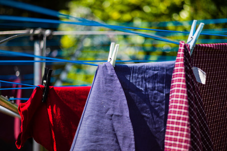 Laundry drying outside in the garden on a washing lineの写真素材