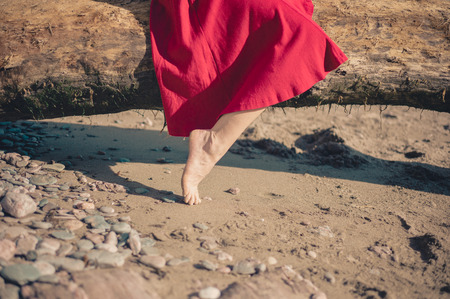 The foot of a young woman as she is relaxing on the beachの写真素材