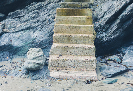 Some concrete steps leading up a cliff on the coastの写真素材