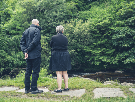 An elderly couple enjoying their retirement in natureの写真素材