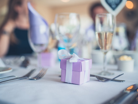 A formal table setting with gifts at a weddingの写真素材