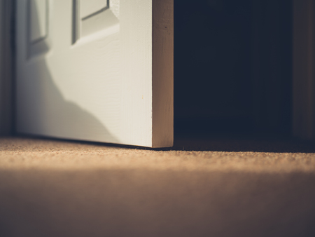 Closee up on an open door at homeの写真素材