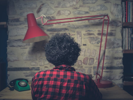 Young hipster man working in cool office with retro technology
