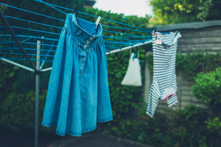 Laundry drying outside in the garden on a rack