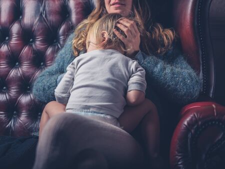 A mother is breastfeeding a toddlerの写真素材