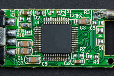 small microchip from a flash drive close-up on a black background