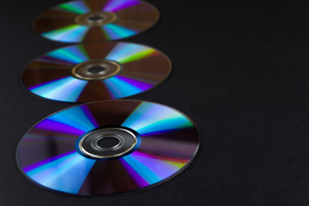 multi-colored and colorful CD on a black background