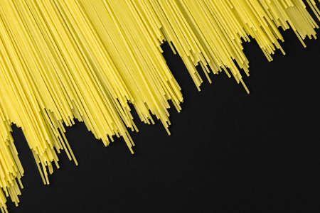 high-quality durum wheat paste lies on a black backgroundの写真素材