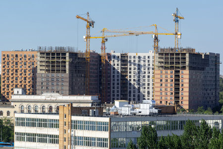construction of residential buildings. construction site and tower cranes on itの写真素材