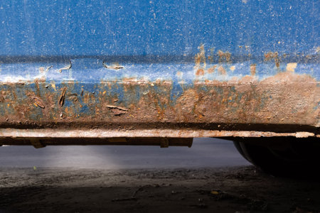severe corrosion on the old blue car. An old rusty car