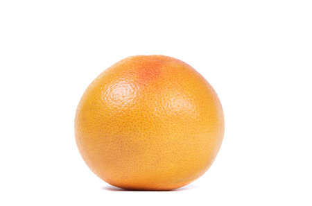 ripe grapefruit and its slices isolated on a white backgroundの写真素材