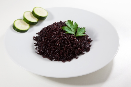 Black rice in a dishの写真素材