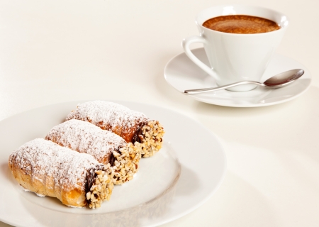 Italian pastries with a coffee cupの写真素材