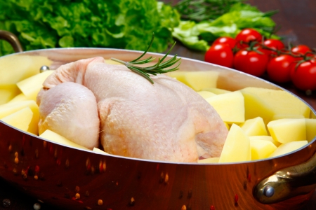 Raw - uncooked - chicken with vegetablesの写真素材