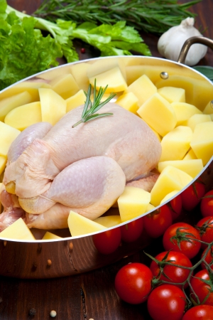 Raw - uncooked - chicken with vegetablesの写真素材