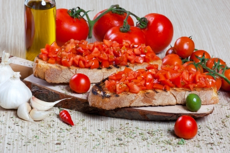 Italian bruschetta with tomatoes, oil and breadの写真素材