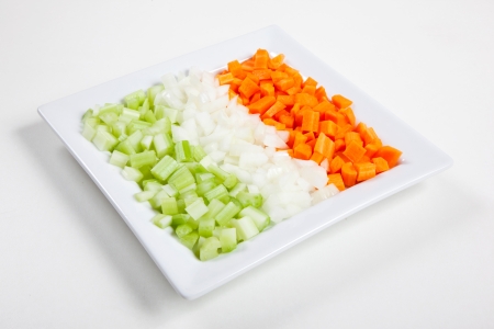 Fresh and natural food, celery, carrots, onion and vegetables on a dishの写真素材