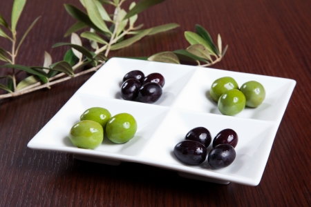 Green and black olives in a dishの写真素材