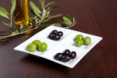 Green and black olives in a dishの写真素材