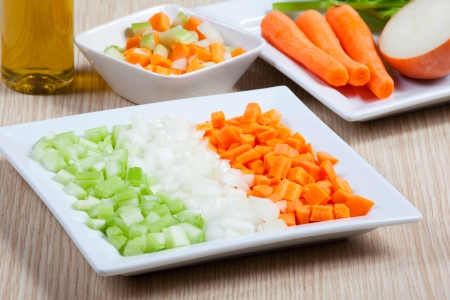 Fresh and natural food, celery, carrots, onion and vegetables on a dishの写真素材