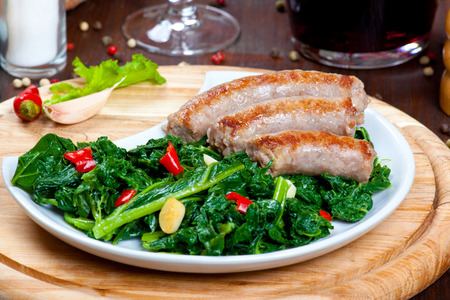 Sausages with vegetable garnish, cime di rapaの写真素材