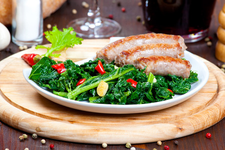 Sausages with vegetable garnish, cime di rapaの写真素材