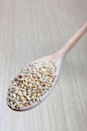 barley on a wooden spoonの写真素材