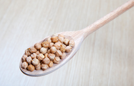 vegetables on a wooden spoonの写真素材
