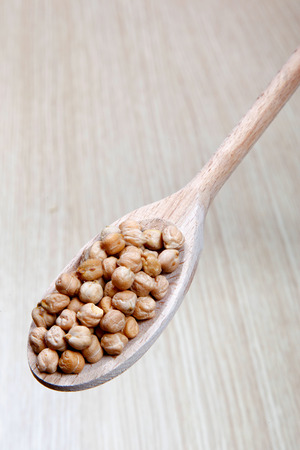 vegetables on a wooden spoonの写真素材