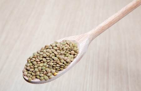 lentils on a wooden spoonの写真素材