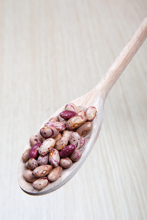 beans on a wooden spoonの写真素材