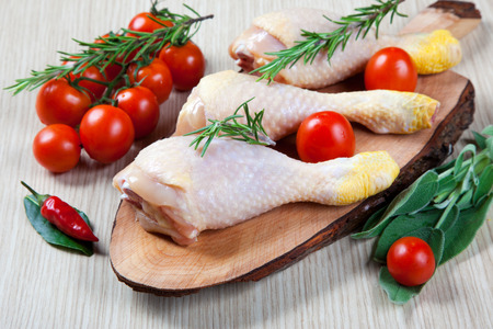 uncooked chicken thigh -raw - chicken with vegetablesの写真素材