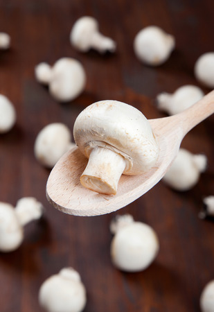 Close-up of champignons on a spoonの写真素材