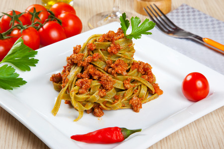 Noodels with meat sauce in a dishの写真素材