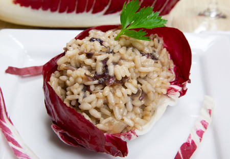 risotto with cicory, radicchio on a dishの写真素材