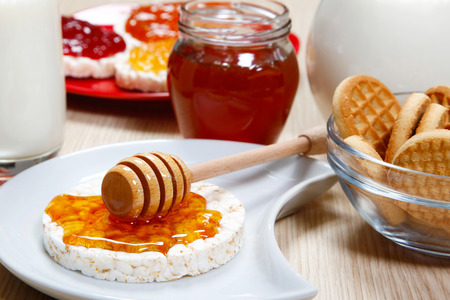 Waffle with honey on a dishの写真素材