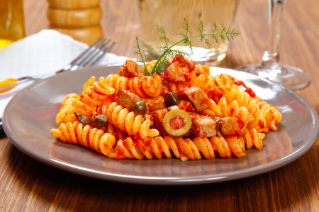 Italian pasta (fusilli) with tuna, olives and capersの写真素材