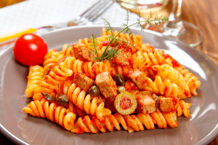 Italian pasta (fusilli) with tuna, olives and capersの写真素材
