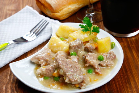 cooked stew with potatoes on a tableの写真素材