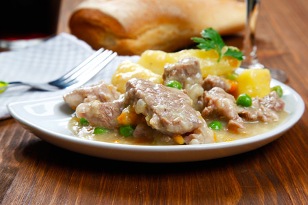 cooked stew with potatoes on a tableの写真素材