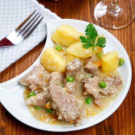 cooked stew with potatoes on a tableの写真素材