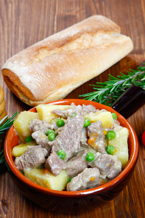 cooked stew with potatoes in a bowlの写真素材