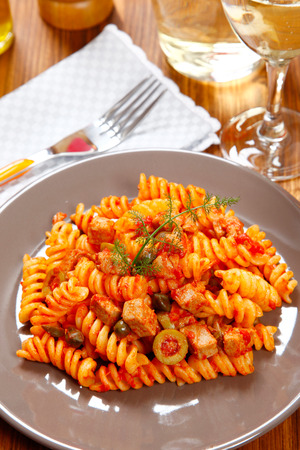 Italian pasta (fusilli) with tuna, olives and capersの写真素材