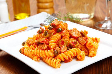 Italian pasta (fusilli) with tuna, olives and capersの写真素材